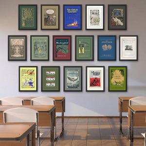 May include: A collection of framed book covers, including "The Great Gatsby," "Oliver Twist," and "Moby Dick," displayed on a wall. The frames are black, and the book covers feature various colors and illustrations. The scene is set in a classroom with wooden desks.