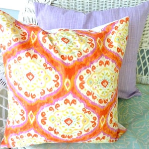 Bright orange and pink ikat pillow cover