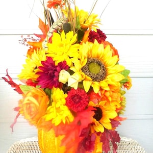 Fall floral arrangements, pumpkin centerpiece