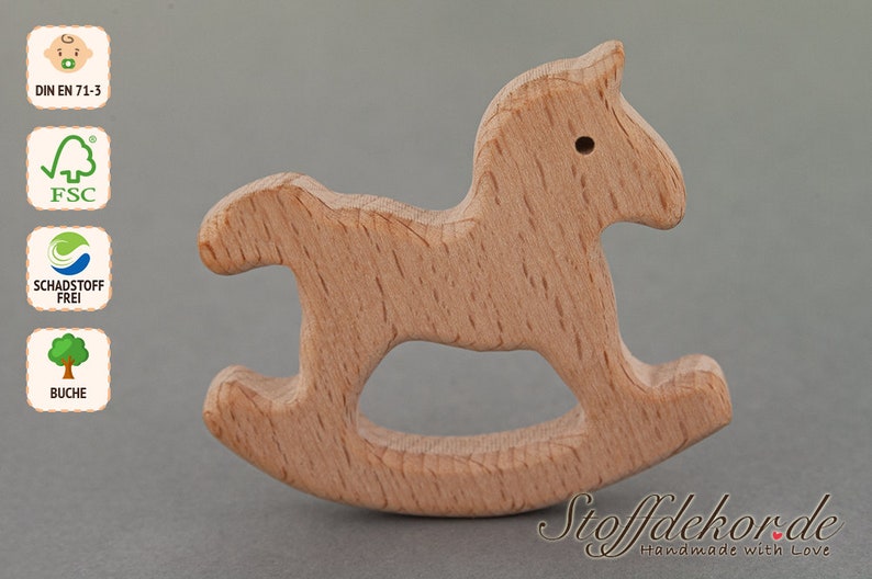 May include: A wooden rocking horse toy made from beech wood. The toy is unfinished and has a natural wood color. The toy is safe for babies and toddlers and is certified by the FSC and DIN EN 71-3.
