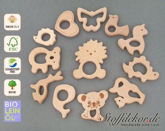 May include: A set of 12 wooden teethers shaped like animals and other objects, including a heart, butterfly, bird, horse, dinosaur, koala, lion, and a deer antler. The teethers are made of natural beech wood and are safe for babies to chew on. The teethers are handmade and come in a variety of shapes and sizes.