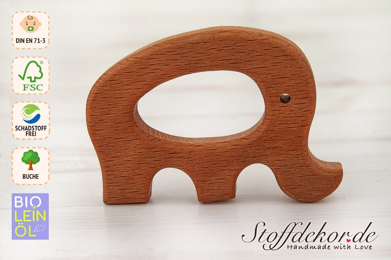 May include: A wooden elephant teether with a smooth, natural finish. The teether is made of beech wood and is certified safe for babies. The teether is shaped like an elephant with a large oval opening in the middle. The teether is a great way for babies to soothe their gums and explore different textures.