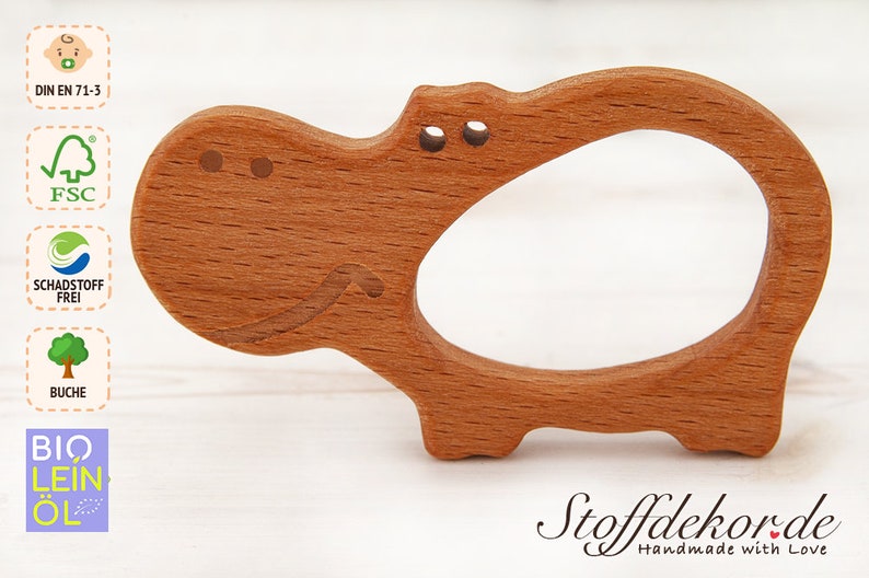 May include: A wooden hippopotamus teether for babies. The teether is made of beech wood and is finished with bio linseed oil. It is certified safe for babies and meets the DIN EN 71-3 safety standard. The teether is also certified by the FSC, which means that the wood comes from sustainably managed forests.