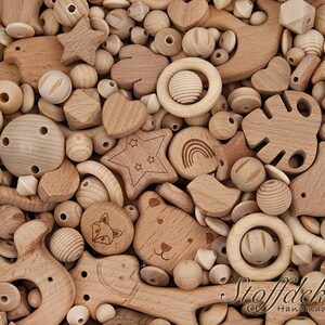 May include: A large assortment of natural wood beads and shapes, including stars, hearts, circles, and animal figures. The beads are perfect for crafting necklaces, bracelets, and other jewelry.