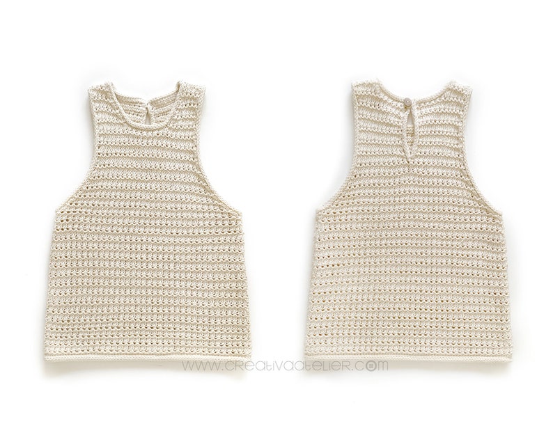 May include: A crocheted tank top in a cream color with a simple design. The tank top has a scoop neck and a wide, open back.