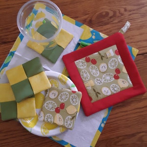Cheer up your morning, a cup of coffee or tea on a Coaster that matches your Pot Holder, holding your pot of coffee.