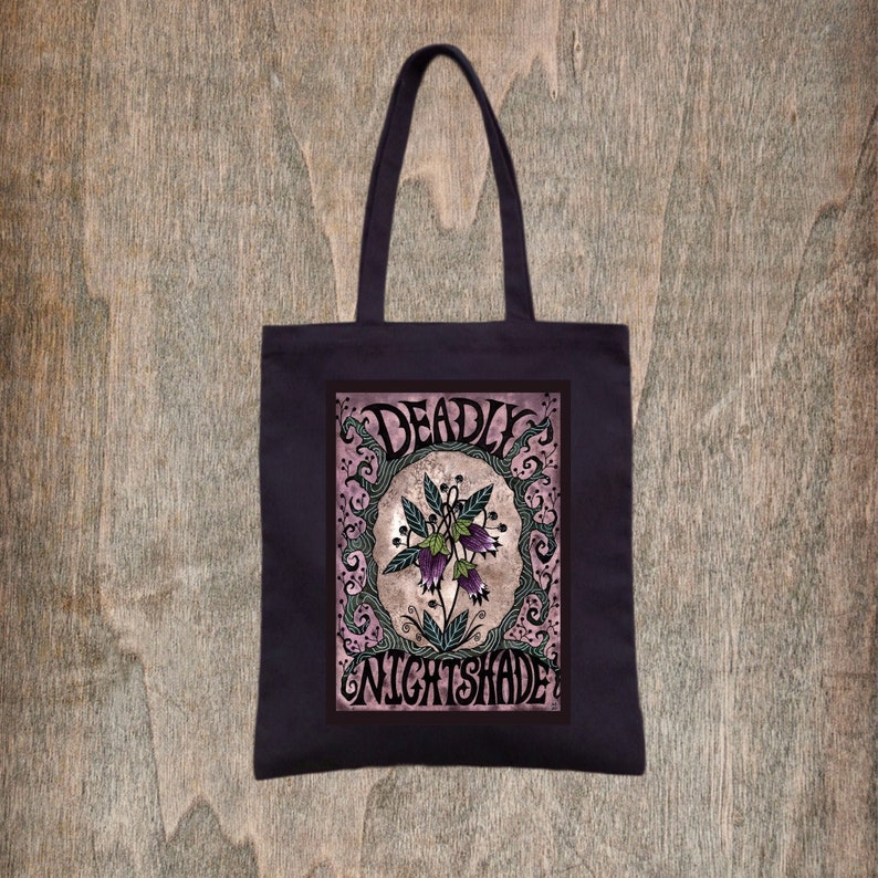 May include: A black tote bag with a pink and white design featuring a purple flower with the text "DEADLY NIGHTSHADE".
