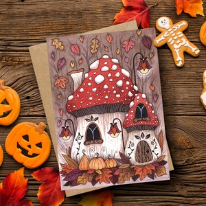 Toadstool Cottage biglietto di auguri e busta - Whimsical Autumn Mushroom House Card - Falling Leaves Halloween Pumpkin Patch Cottagecore Card