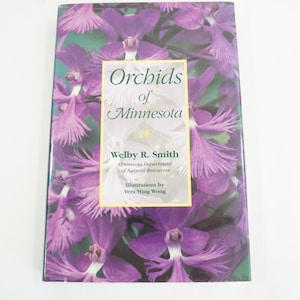 May include: A book titled "Orchids of Minnesota" by Welby R. Smith, featuring a close-up image of purple orchids.
