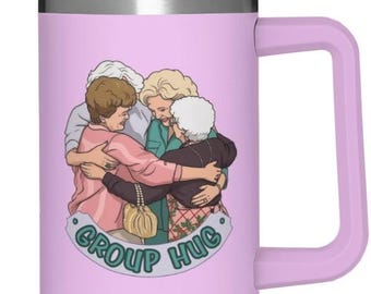 May include: A light purple stainless steel tumbler with a handle and a clear lid. The front features a graphic illustration of four older individuals in a group hug, with the text "GROUP HUG" printed in a teal curved banner underneath the figures.