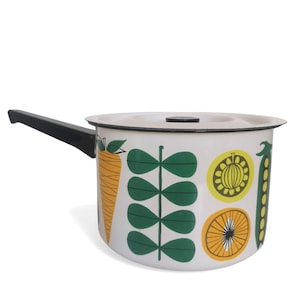 May include: White enamel saucepan with a black handle and a lid. The saucepan has a colorful design of vegetables, including carrots, peas, and a lemon.