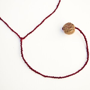 Burgundy Pendulum Necklace with Brass Bead. Fiber Jewelry. Fiber Necklace. Hand-Dyed Silk. Silk Necklace. Fair Trade Bead. Lariat Necklace. image 3