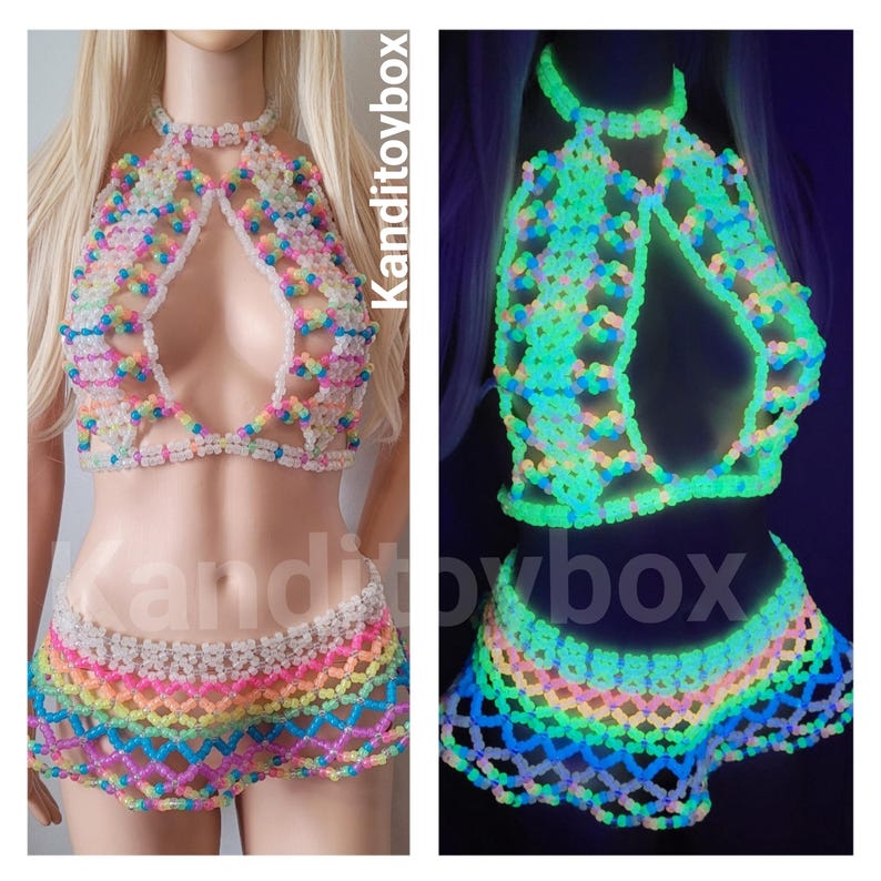 May include: A two-piece set consisting of a halter top and a skirt made from translucent, multi-colored plastic beads arranged in a lattice pattern. The set glows in the dark, emitting a bright neon green light. The text Kanditoybox is visible.