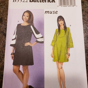 May include: A sewing pattern for a dress with a round neckline and short sleeves. The pattern is for sizes 8-10-12-14. The pattern is from Butterick and is called "muse".