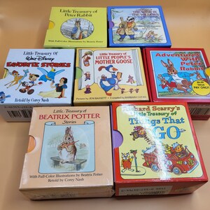 May include: A collection of six colorful children's books featuring classic characters like Peter Rabbit, Winnie the Pooh, and Mother Goose. The books are all small and have a similar design, with a white background and colorful illustrations.