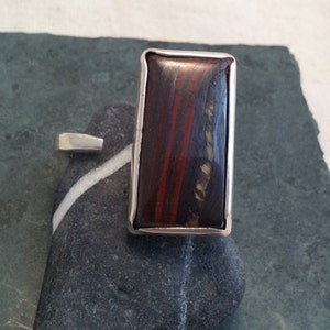 Rectangular stunning red tigers eye ring with unusual open shank