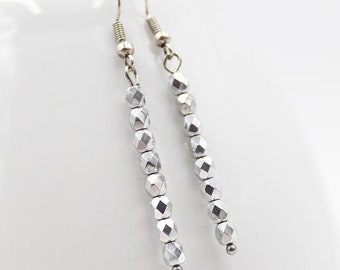 Earrings made of faceted glass beads in silver