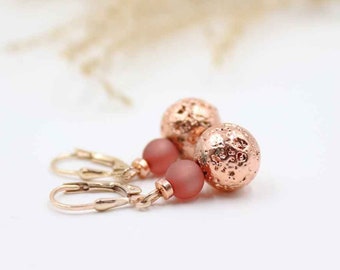 Hanging earrings made of a rose gold-colored lava-look pearl and a matt polaris pearl, real silver