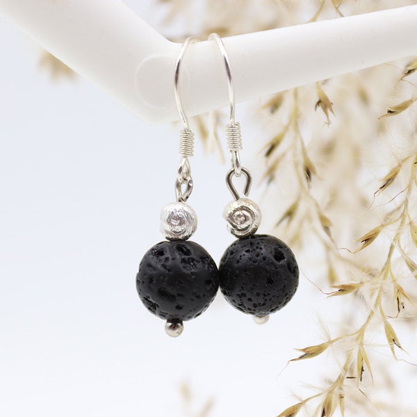 Earrings made of lava and small snails made of real silver