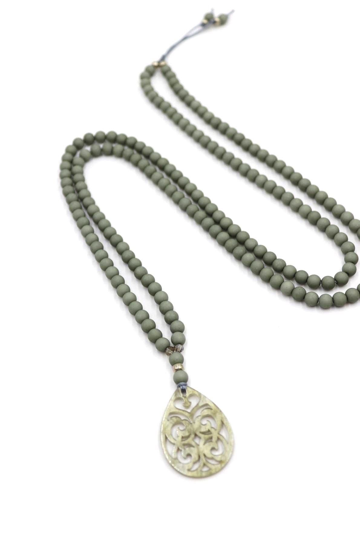 Necklace made of acrylic beads in green-grey and acrylic pendant