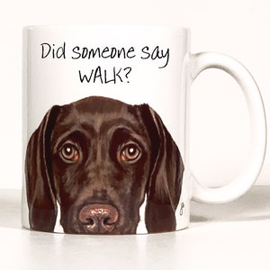 May include: White ceramic coffee mug with a brown dog's face and the text "Did someone say WALK?" printed on it.