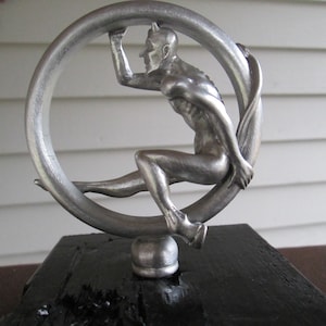 vintage satan in tire, speed demon, rolling devil car hood ornament