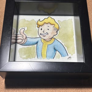 Vault Boy, ritratto ad acquerello incorniciato in una teca 4x4