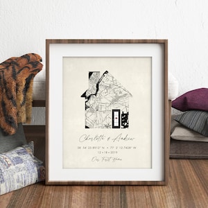May include: A black and white map of a city is shaped like a house with a red heart on the front door. The text below reads "Charlotte & Andrew 38 54' 25.8912" N 77 2' 12.7428" W 12-18-2019 Our First Home"