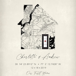 May include: A black and white map of a city in the shape of a house with a red heart in the doorway. The text below reads "Charlotte & Andrew 38 54' 25.8912" N 77 2' 12.7428" W 12.18.2019 Our First Home"