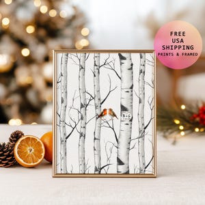 May include: Framed art print featuring a black and white birch tree forest with two small birds perched on a branch. The print is in a gold frame. The image includes the text "B+G 1.31.23".