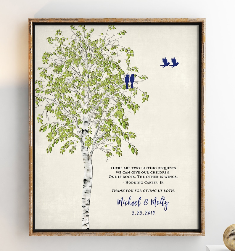 May include: A framed print with a watercolor illustration of a birch tree with green leaves and a white trunk. Three blue birds are perched on a branch and two more are flying away. The print includes a quote about giving children roots and wings, attributed to Hodding Carter Jr. The print is signed "Michael & Molly" and dated "5.25.2019".