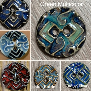 May include: Assortment of ceramic buttons with a geometric pattern in various colors, including blue, green, red, and gold. The buttons have two holes and are approximately 1 inch in diameter.