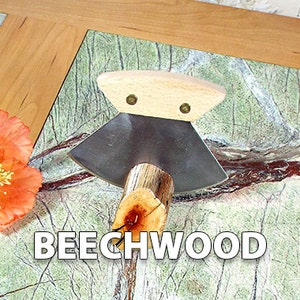 May include: A close-up of a small, hand-crafted wood carving tool with a wooden handle and a metal blade. The tool is resting on a green and brown marble surface. The text "BEECHWOOD" is visible in the image.