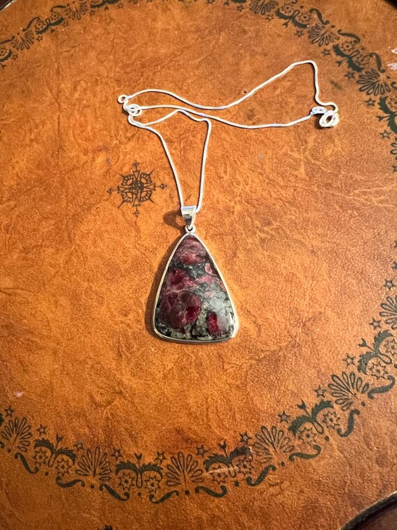 A purple triangular shaped Eudyalite crystal pend… - image 2