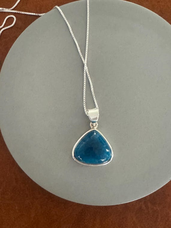 A deep blue rounded triangular shaped cavensite p… - image 2