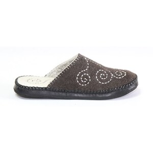 May include: Brown felt slippers with a white stitched swirl design and a black rubber sole.