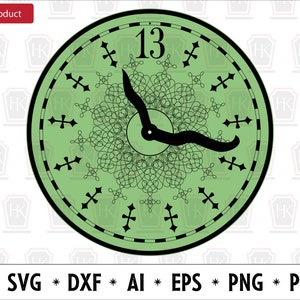 May include: A green clock face with black Roman numeral markings and a black clock hand pointing to the number 13. The clock face has a decorative black design in the center.
