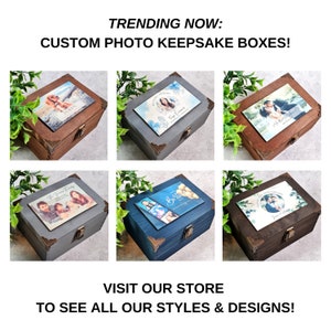 May include: Six wooden keepsake boxes with custom photo lids. The boxes are in various colors, including brown, gray, and blue. Each box has a different photo on the lid, including a family photo, a photo of a dog, a photo of a couple, and a photo of a baby.