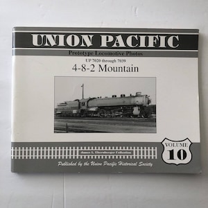 May include: A book titled "UNION PACIFIC" with the subtitle "Prototype Locomotive Photos." The cover features a black and white image of a train and the text "4-8-2 Mountain." The book is Volume 10 of the James L. Ehernberger Collection.
