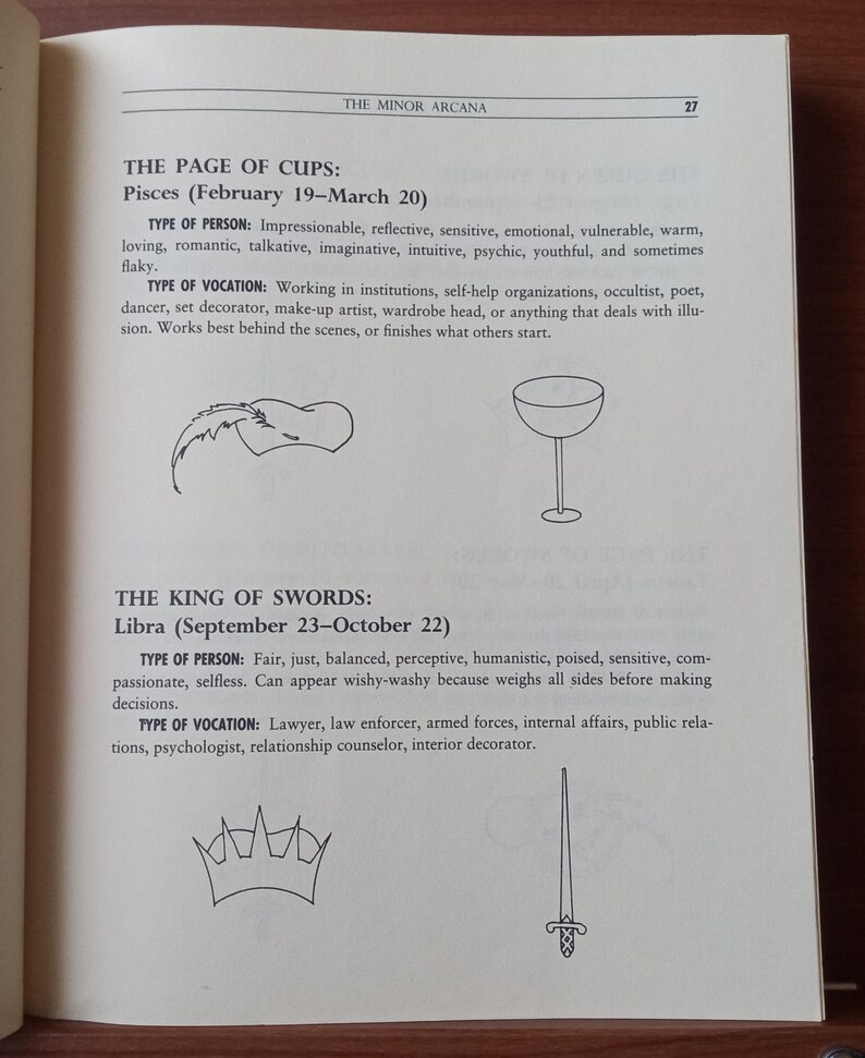 May include: Two tarot cards, The Page of Cups and The King of Swords, with their corresponding zodiac signs and descriptions. The Page of Cups shows a cup with a wave-like design and the King of Swords shows a sword with a crown.