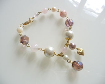 Beaded bracelet, pink bracelet with charms.