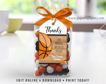 May include: A clear cellophane bag tied with an orange ribbon, filled with orange, black, and white candies. A tag with a basketball graphic reads "Thanks for making my day so special!" and "Your friend, Jordan."