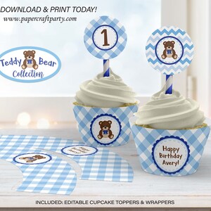 May include: Editable cupcake toppers and wrappers featuring a blue and white gingham pattern with a teddy bear design. The toppers include a blue chevron pattern with a teddy bear and the number one. The wrappers include a blue gingham pattern with a teddy bear and the text "Happy Birthday Avery!"