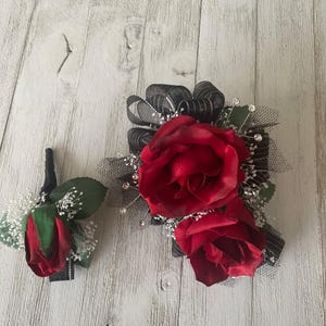 Wrist corsage matching boutonniere in red roses with black trim-READY TO SHIP