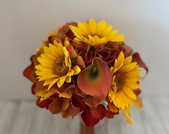 Bridesmaid bouquet designed with sunflowers and real touch mini calla lilies