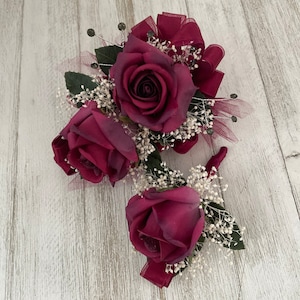Wrist corsage and boutonniere in burgundy