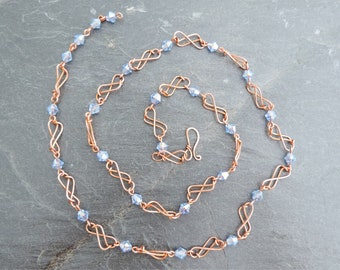 Infinity Symbols Necklace, Faceted Sky Blue Glass Beads. Graceful Shiny Copper Wire Links, Long Adjustable Chain. Twice Around is a Choker.