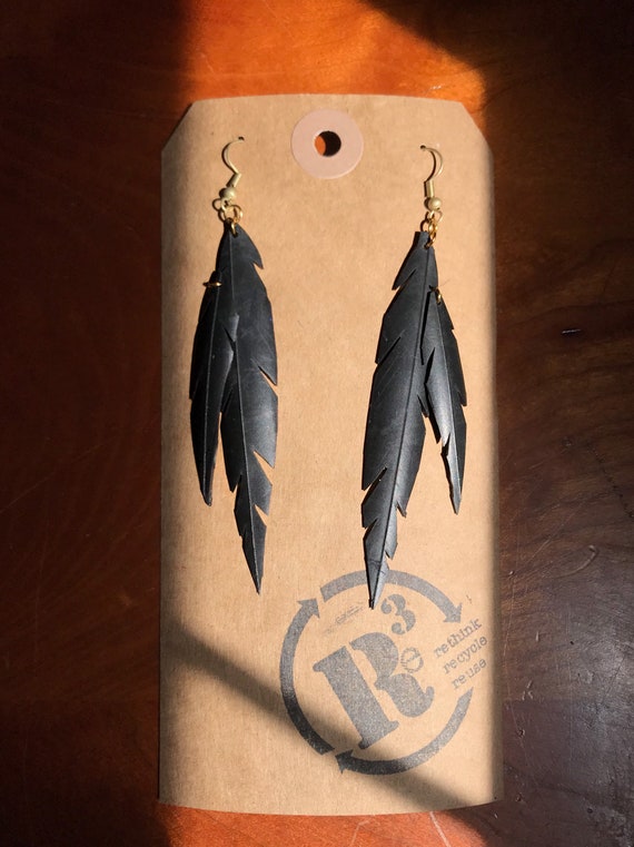ROCK RAVEN feather earrings made from up cycled bicycle inner tube.