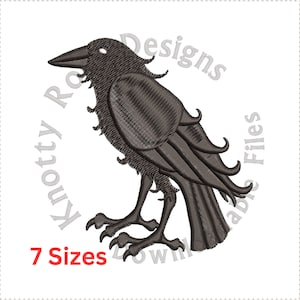 May include: A black embroidered design of a raven, with the text "Knotty Designs Downloadable Files" in a circle around it. The text "7 Sizes" is below the raven.