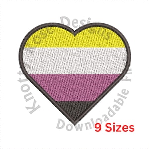 May include: A heart-shaped patch featuring the non-binary pride flag. The flag has horizontal stripes in yellow, white, purple, and black, with a black border. The text "9 Sizes" is in red.